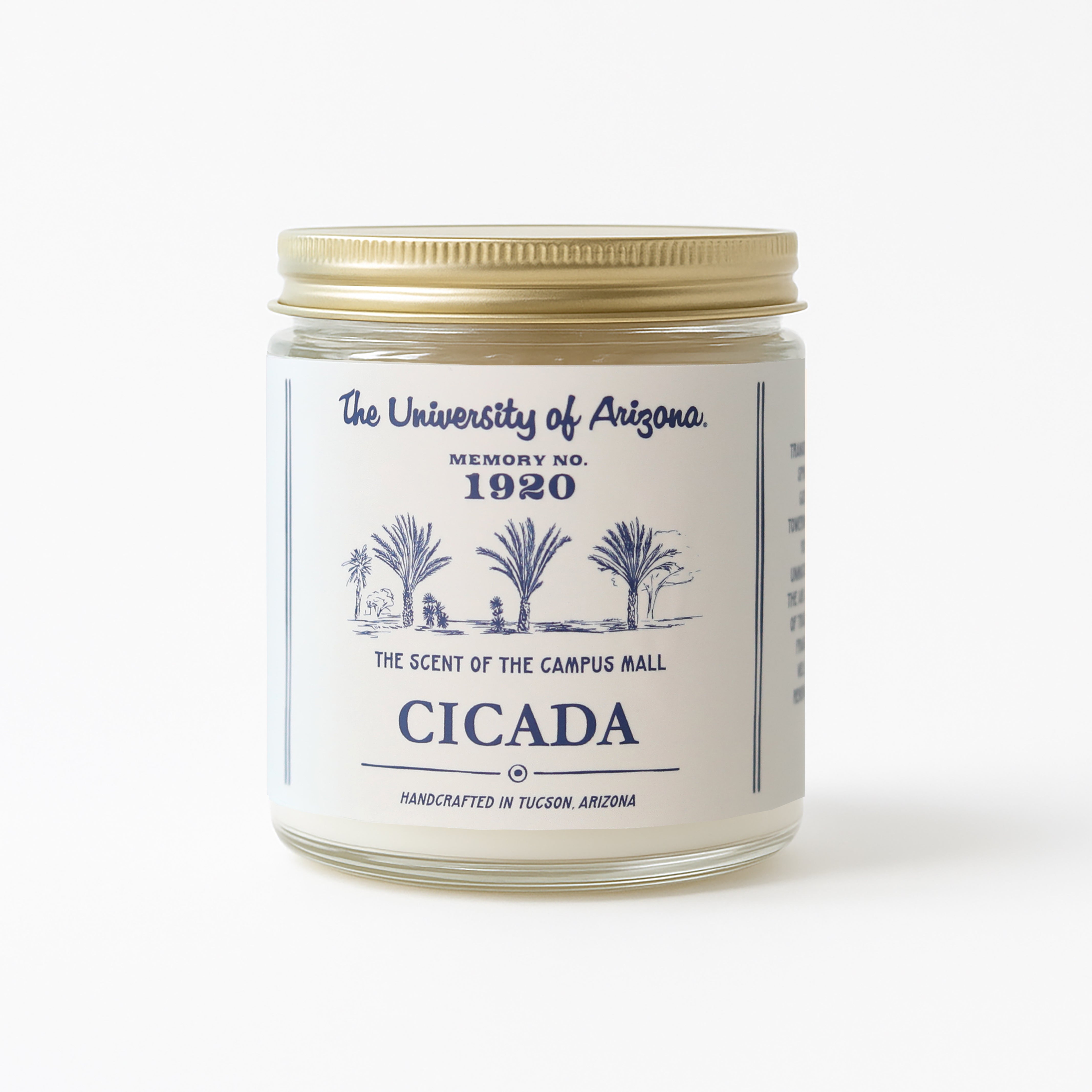 Candle jar with label featuring 'The University of Arizona' and 'Cicada' text on a white background