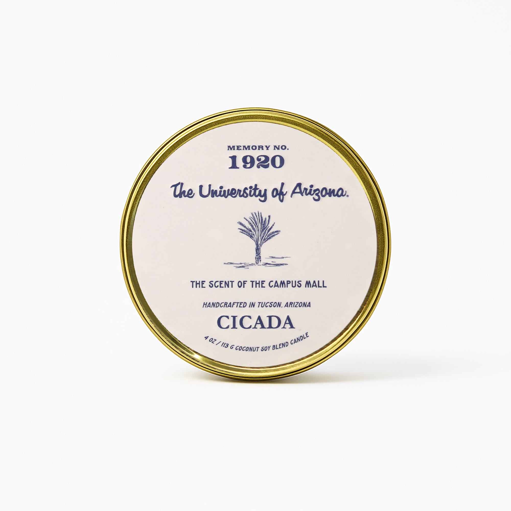 Gold tin candle with 'The University of Arizona' branding on a white background